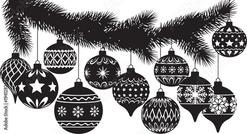 Black and white Christmas ornaments on a pine branch
