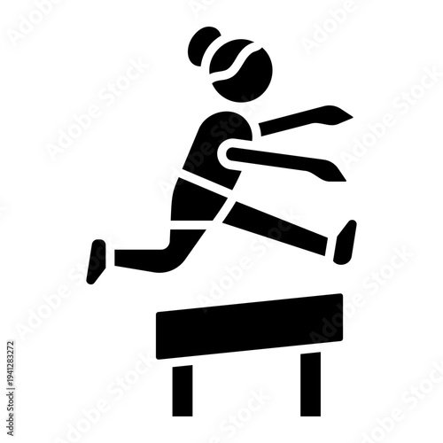 Woman Hurdler Jumping Over Hurdle in Track Event