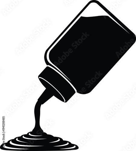 Bottle of sauce pouring on surface