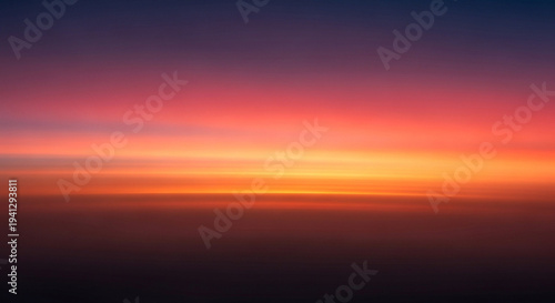 Vibrant sunset sky with warm orange and red hues in the atmosphere