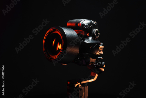 new electronic gyroscopic stabilizer for small SLR and mirrorless cameras and still cameras controlled via smartphone or joystick
