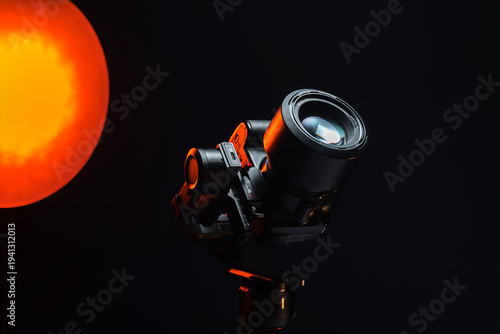new electronic gyroscopic stabilizer for small SLR and mirrorless cameras and still cameras controlled via smartphone or joystick