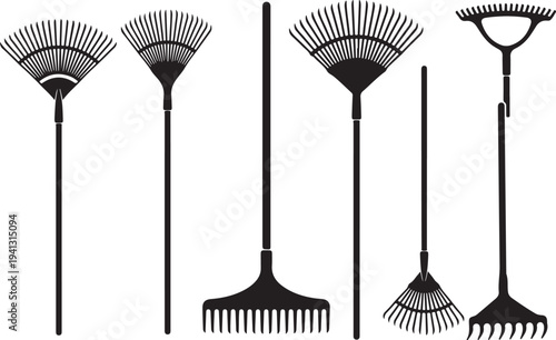 Collection of various garden rakes and tools on display