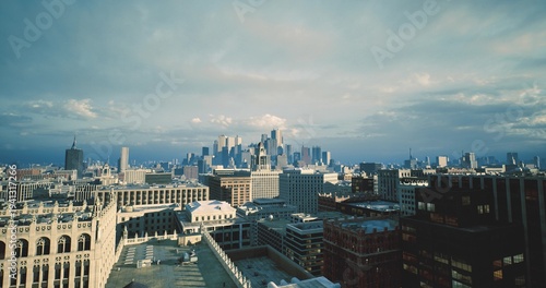 historic building facades meet modern skyline backdrop, ornate cornices and textured masonry visible, narrow rooftop lines, cultural district vibe with layered
