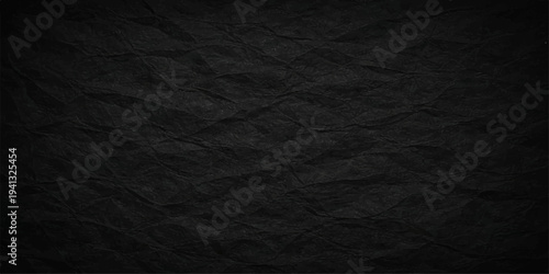 A high-quality macro view of a dark grunge background featuring a blend of rough black paper texture and a patterned black leather surface design