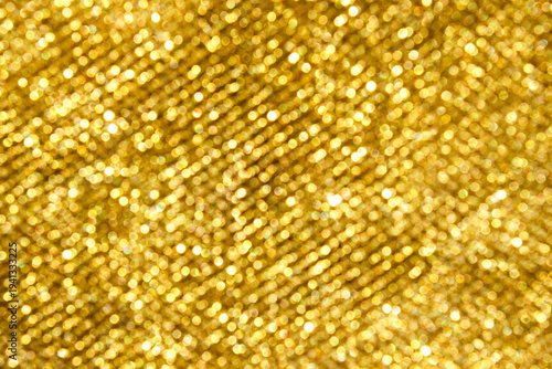 Gold glitter bokeh background with warm sparkle and festive texture for celebration
