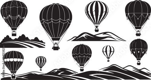 Hot air balloons flying over mountains in black and white