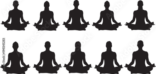 Silhouette of people meditating in various yoga positions together