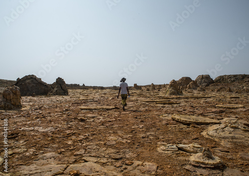Afar man in the volcanic formations of the danakil depression, Afar region, Dallol, Ethiopia