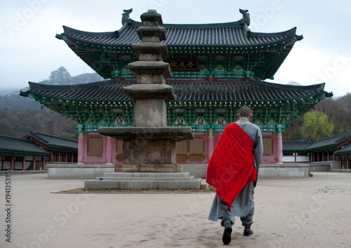 North Korean monk in front of Ryongthong temple founded by Korean chonthae sect of buddhism, Ogwansan, Ryongthong Valley, North Korea