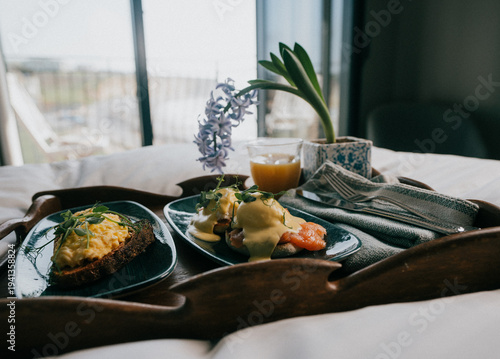 Tableau sur toile Delicious breakfast tray with eggs benedict and avocado toast