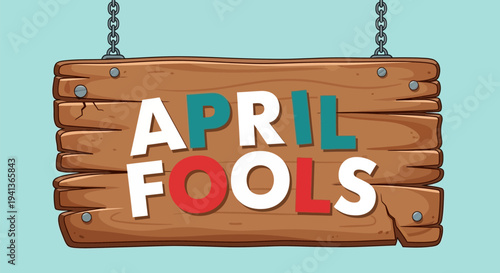 Colorful wooden sign with 'april fools' text hanging on chains against light blue background