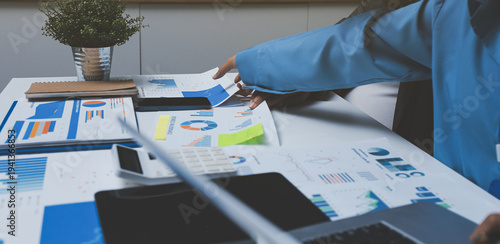 Auditor and accountant team working in office, analyze financial data and accounting record with calculator. Accounting company provide finance and taxation planning for profitable cash flow.