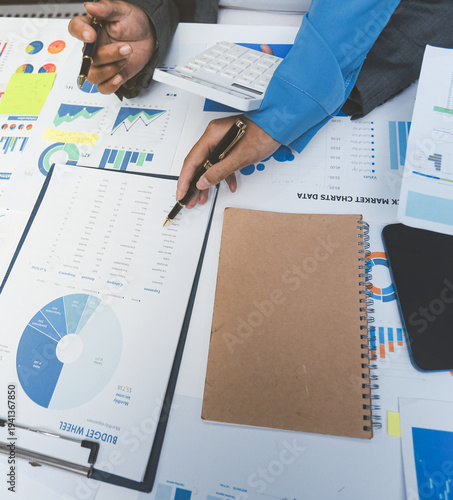 Auditor and accountant team working in office, analyze financial data and accounting record with calculator. Accounting company provide finance and taxation planning for profitable cash flow.