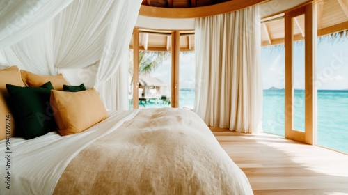 An inviting bedroom designed with elegance and comfort, featuring large windows that overlook a stunning ocean view, promoting relaxation and peacefulness in a tranquil setting.