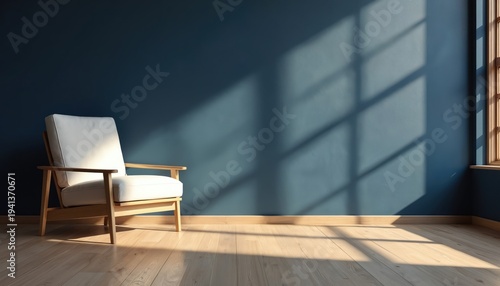 Wallpaper Mural Minimalist room features white armchair beside dark blue wall. Bright sunlight casts geometric shadows from window across wooden floor. Calm, modern interior scene. Torontodigital.ca