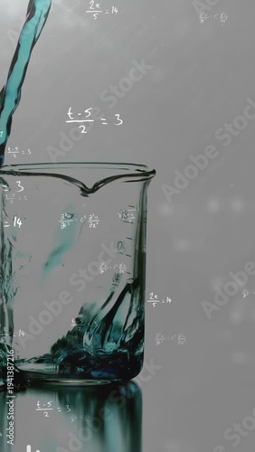 Vertical video: Turquoise stream entering upper left, pouring into clear beaker, showing turbulence