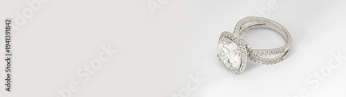 Banner with copy space. A large diamond ring with a white band