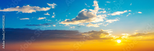 Banner with copy space. A beautiful sunset over a city with a few clouds in the sky