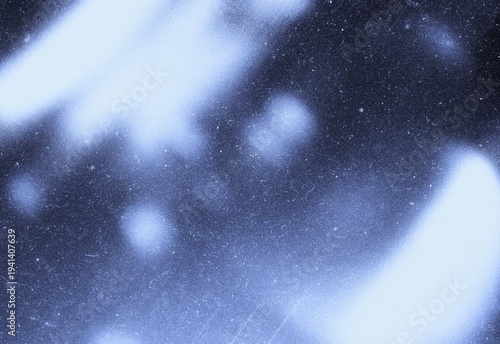 Blue vintage film grain texture with light bokeh and dust scratches