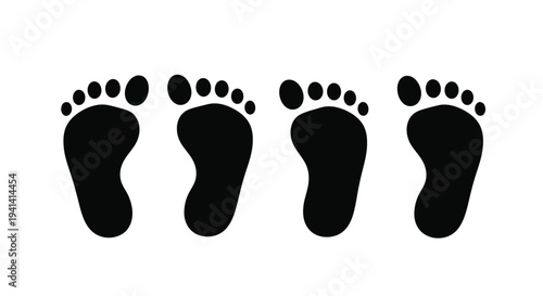 Four black footprints arranged in a row stark silhouette