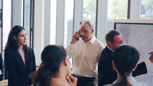 Business meeting office presentation colleagues discussion teamwork professional whiteboard strategy communication diverse group corporate collaboration leadership planning people businessman