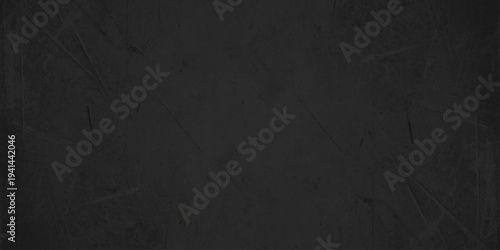 dark black chalkboard texture background with subtle scratches and grain, empty weathered stone or slate wall surface