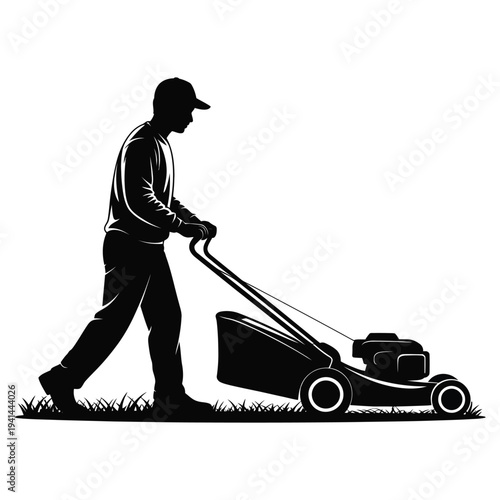 Silhouette Of Man Mowing Lawn With Push Mower lawnmower