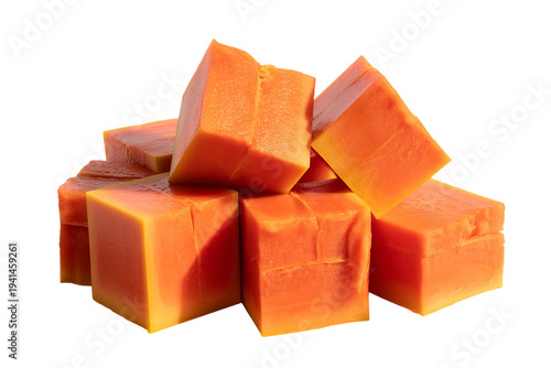 Ripe orange papaya fruit cubes piled together isolated on transparent background for healthy breakfast and tropical food design cutout.