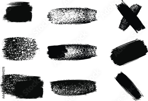 A collection of nine black ink brush strokes on a white background