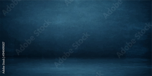 A dark blue grunge background with a vintage textured pattern on an old aged concrete wall surface provides an empty rough paper backdrop for design