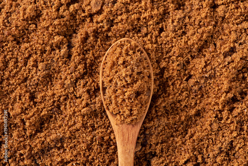 Tablou pe pânză closeup of brown sugar background. Raw unrefined cane sugar