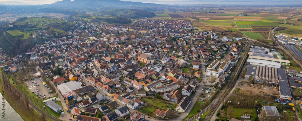 Obraz premium Aerial view around the old town of the city Riegel am Kaiserstuhl in Germany on a sunny late autumn noon