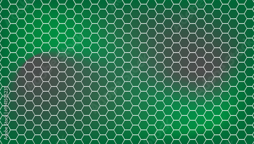 Close-up of a green soccer goal net with hexagonal pattern, stadium lighting, sports background.