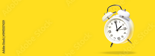 Wallpaper Mural White bell alarm clock hovering over yellow background. 2 to 3 clock concept isolated. daylight savings time change concept Torontodigital.ca