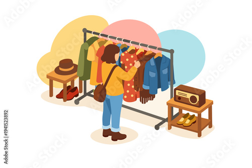 Woman browsing clothes on a rack at a thrift store.