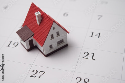 House on blank white calendar background copy space. Mortgage payment due, real estate property reminder, make contract appointment, property tax dues payment, home construction schedule concept.