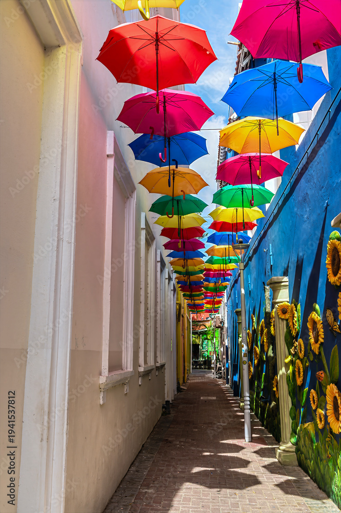 Fototapeta premium A view up the Umbrella Street in the Punda district in Willemstad, Curacao on a bright morning