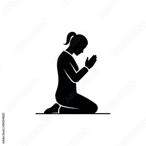 Silhouette of a woman kneeling in prayer a symbol of faith and devotion.