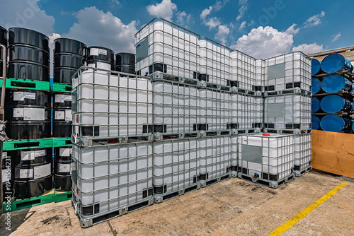 The stock of plastic barrels for the chemical industry. white plastic containers. Chemical industry.