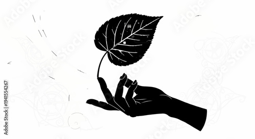 Gentle hand holding a delicate leaf, symbolizing nature's fragility and care.