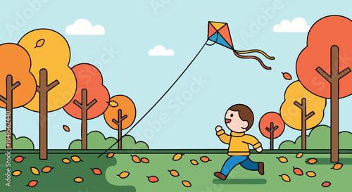 Happy boy flying a kite in autumn park.