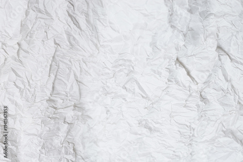 Crumpled white paper background.