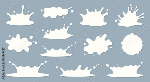 A collection of white milk splashes and spills against a blue background showcasing varied shapes and forms silhouette high quality