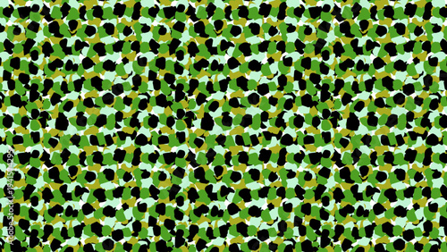 Seamless camouflage speckle pattern with green, black, and tan organic shapes. Abstract texture.