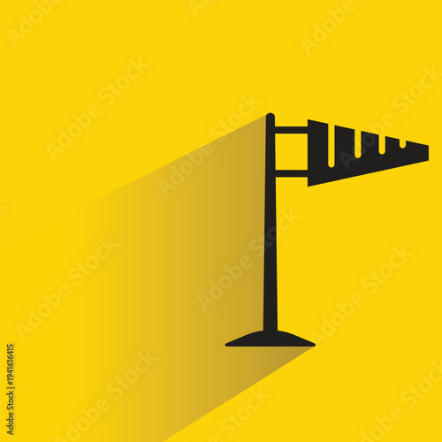 windsock pole icon with shadow on yellow background
