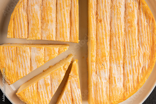 Soft cheese Tartiflette tasty cow milk, goat or sheep French food snack fresh delicious gourmet food background on the table rustic food top view copy space