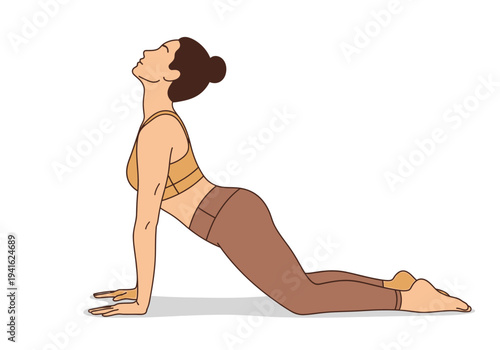 Woman performing upward facing dog yoga pose with focus and grace.