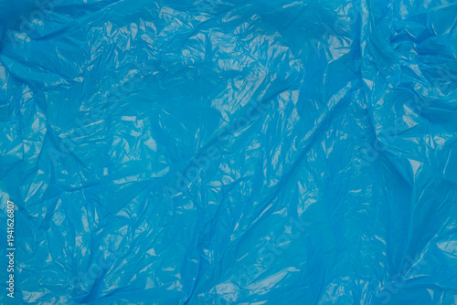 Abstract pattern and texture background of wrinkled and crumpled blue plastic bag surface. For graphic design, 3D rendering and banners