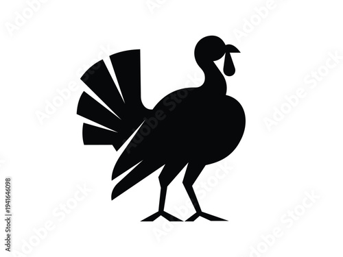 A simple black silhouette of a turkey, standing with its tail fanned out. The image is isolated on a clean white background, making it suitable as an icon or graphic for Thanksgiving or fall themes.
